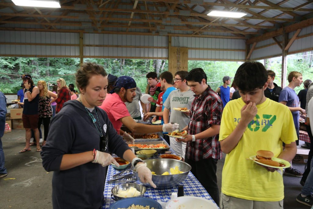 Campers and staff sharing a meal at Summit.