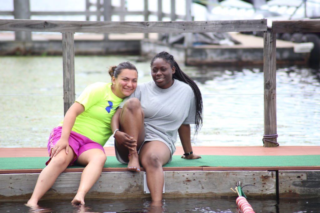 Summit participants spend time together by the waterfront.