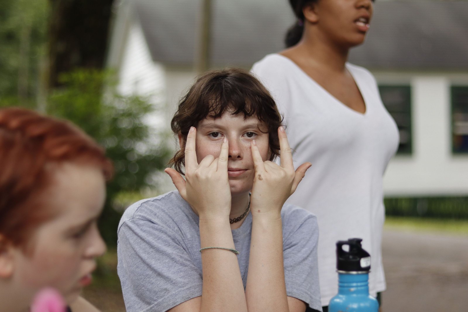 A camper and staff member share a warm moment at Summit.